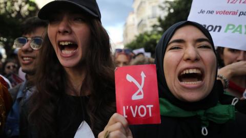 Algerian women protest against the 12 December vote