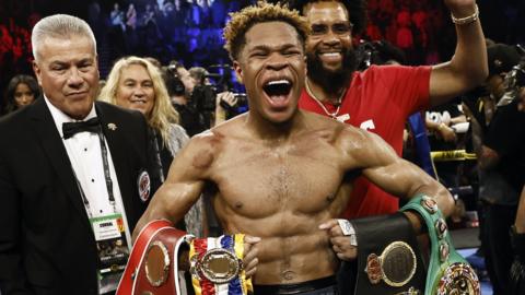 Devin Haney celebrates his win against Vasiliy Lomachenko