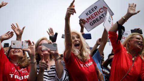 Supporters cheer for Mr Trump during his visit to North Carolina