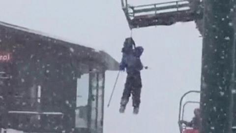 Dangling skier