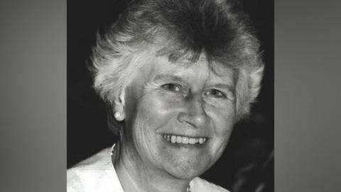 A black and white image of Beryl Purdy smiling