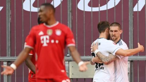 Union Berlin players celebrates scoring at Bayern Munich