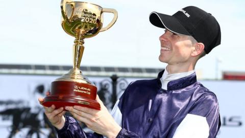 Jockey Jye McNeil after winning the Melbourne Cup on Twilight Payment