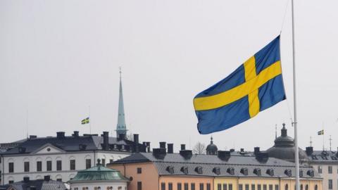 Flag at half mast at the official ceremony at Stockholm City Hall with one minute of silence at noon to remember the victims of Friday"s terror attack on Drottninggatan