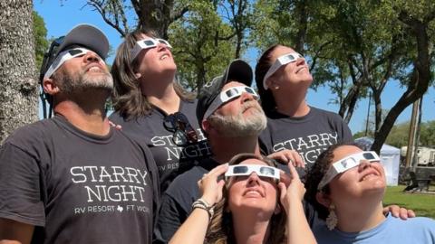 Sky watchers test their eclipse glasses in Texas