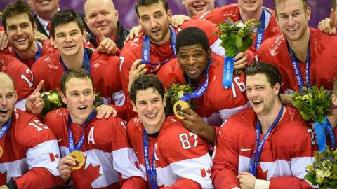 Canada celebrate winning gold at the 2014 Winter Olympics