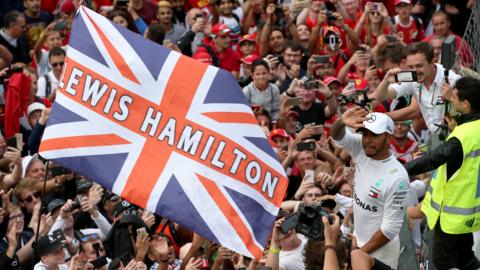 Lewis Hamilton celebrates winning the Italian Grand Prix at Monza