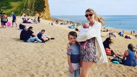 Danielle Spencer with her children at the beach