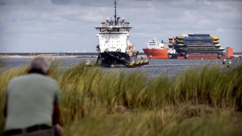 A ship enters the port of Rotterdam