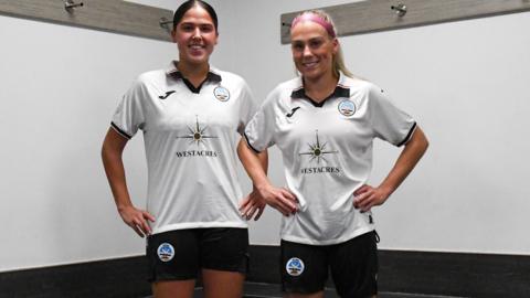 Jess Williams and Ellie Lake in Swansea Ladies' white tops and black shorts