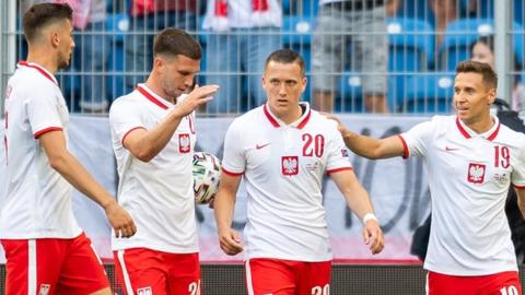 Poland celebrate scoring against Iceland