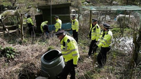 Police search teams in Roedale Valley Allotments on the Sussex Downs.