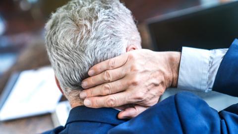 Stock image of a stressed man