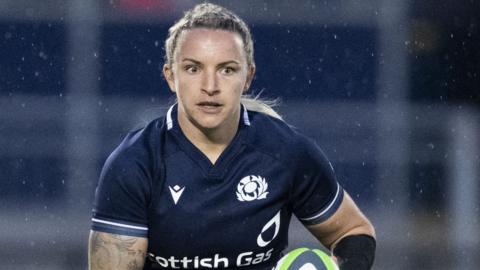 Scotland full-back Chloe Rollie carries the ball forward