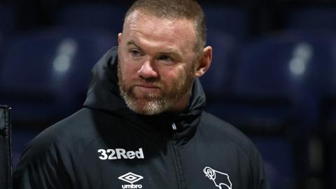 Wayne Rooney on the touch line at Preston