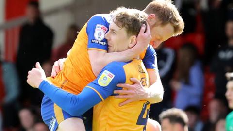 Mansfield celebrate a goal