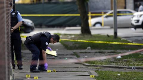 Chicago Police officers and detectives investigate a shooting where multiple people were shot on Sunday, August 5, 2018 in Chicago, Illinois