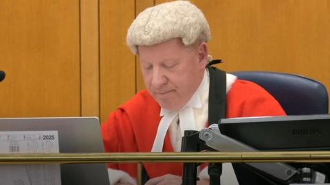 A judge in red robes