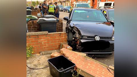 Car in a wall