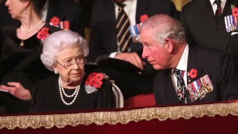 Britain"s Queen Elizabeth II and Britain"s Prince Charles, Prince of Wales attend the annual Royal British Legion Festival