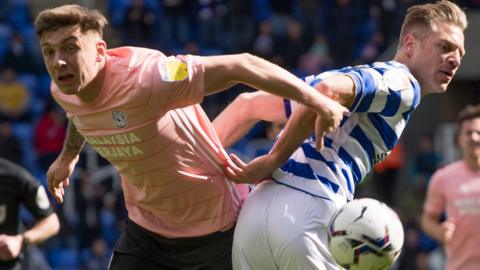 Jordan Hugill of Cardiff City battles for the ball