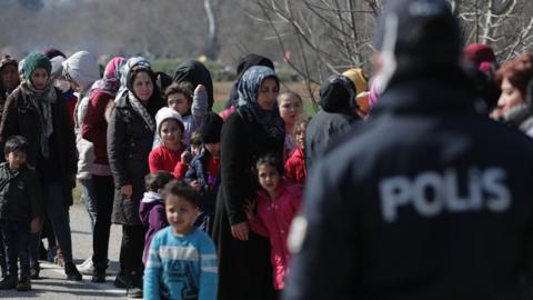 Turkish police watch migrants near Greek border, 29 Feb 20