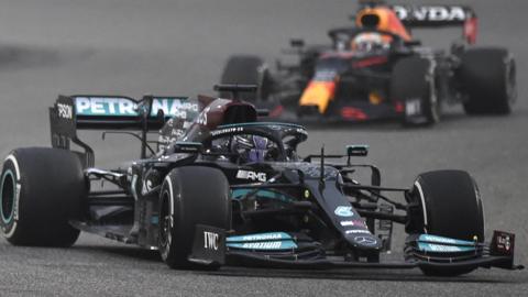 Lewis Hamilton leads Red Bull's Dutch driver Max Verstappen during testing