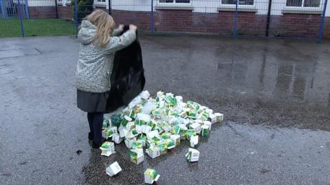 children emptying waste bags