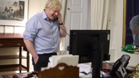 Prime Minister Boris Johnson during a phone call with US Presient Joe Biden