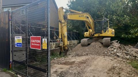 Digger on site of demolition