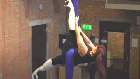 Aerial artist with prosthetic legs