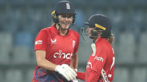 Nat Sciver-Brunt and Danni Wyatt shake hands in the first T20 against India