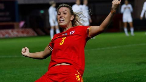 Gemma Evans celebrates scoring against Kazakhstan