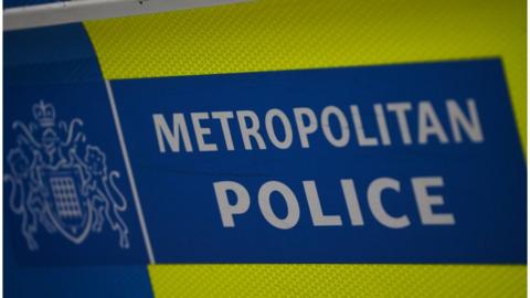 A photo of the metropolitan police sign