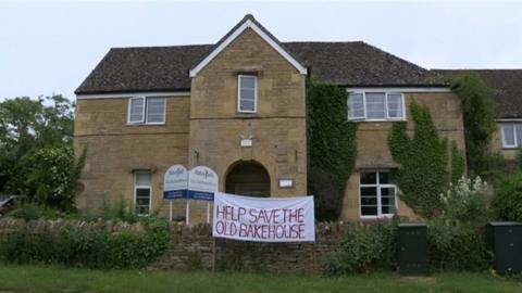 The Old Bakehouse in Chipping Norton with a banner outside