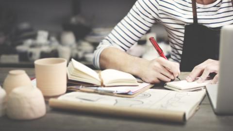 A self-employed worker doing her paperwork