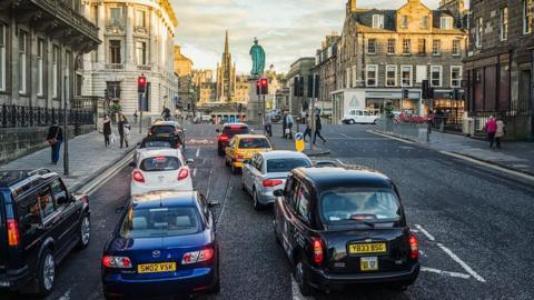 Black cab and other cars in Edinburgh