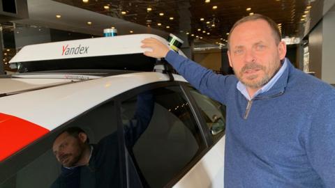 Yandex founder Arkady Volozh with one of the firm's self-driving cars