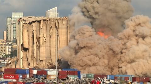A smoke plume rises after the new collapse of the northern section of the grain silos at the port of Lebanon's capital Beirut