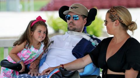 Pete Frates with his wife and daughter at his side