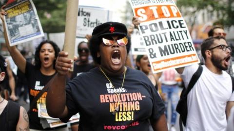 People protest against the deaths of black men at the hands of police