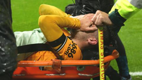 Wolves' Pedro Neto is stretchered off against Newcastle
