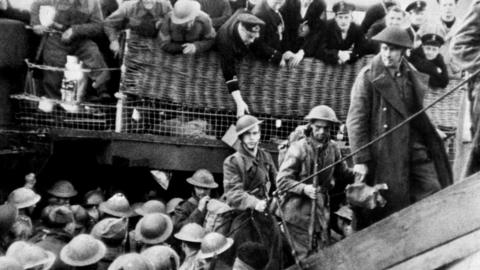 British soldiers are assisted by the Royal Navy on their return to England after being evacuated from the beaches of Dunkirk, northern France