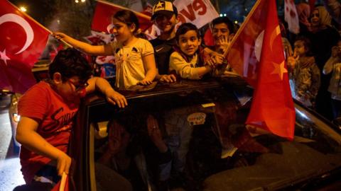 People celebrate the "Evet" (Yes) vote result outside AK Party headquarters in Istanbul, 16 April 2017