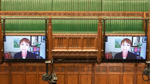 MP addresses Commons on a screen