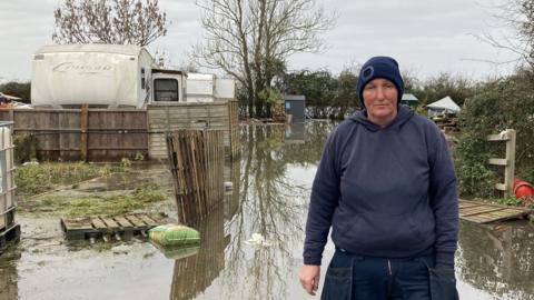 Dawn Smith standing in floodwater