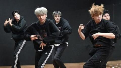 A K-pop group practice in a dance studio in Seoul