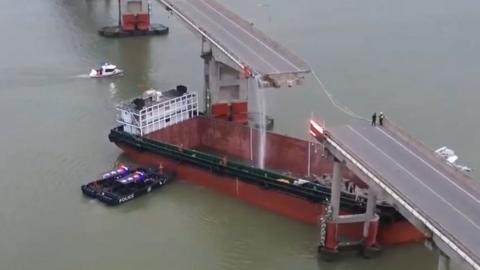 A cargo ship rammed into a bridge in China, plunging vehicles into the river.