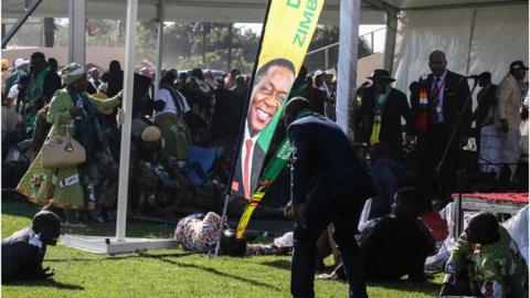 People lying on the ground after the explosion.