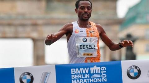 Kenenisa Bekele breaking the finishing tape to win the 2019 Berlin Marathon